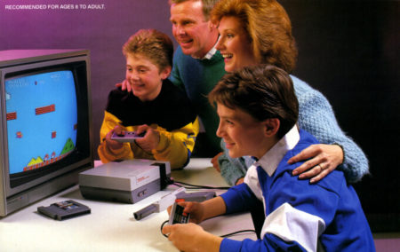 An image from the NES box of a family playing the NES game console together.